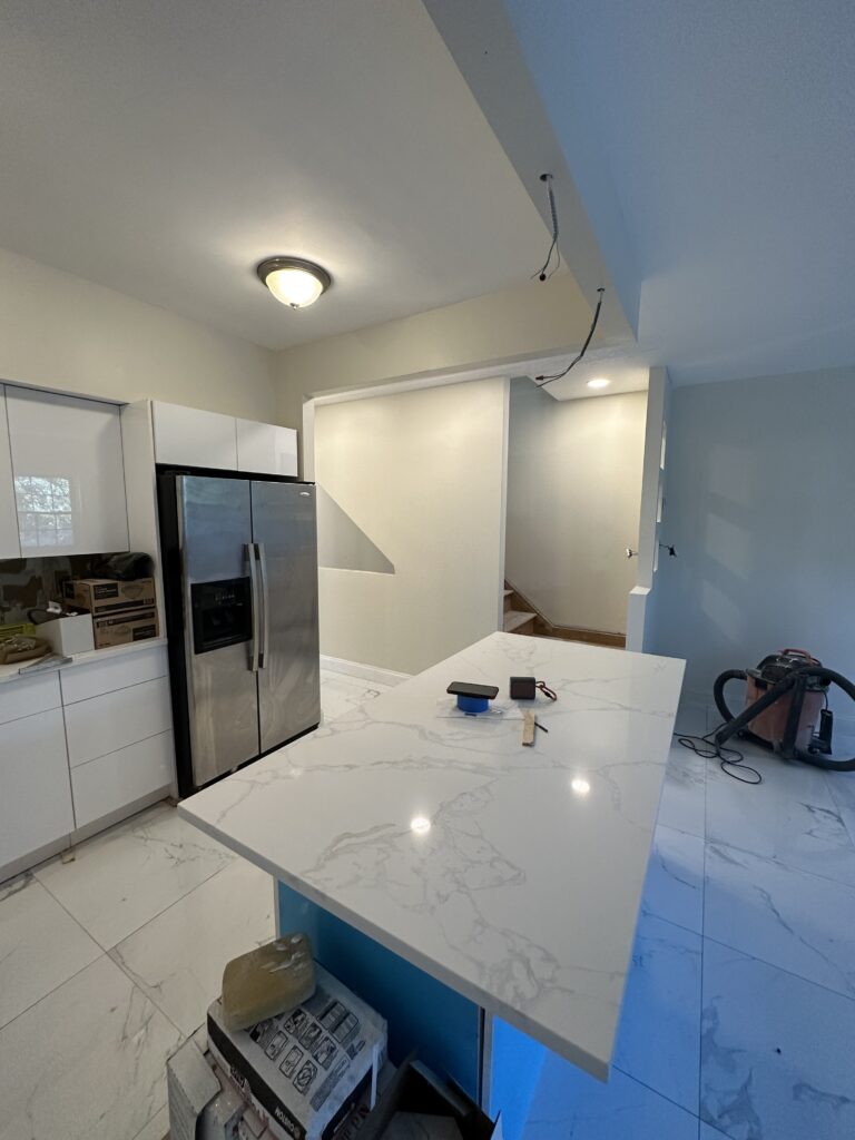 This project was a full kitchen transformation completed by DLS Construction LLC, starting from a complete demolition of the existing space.
The original kitchen was outdated, enclosed, and lacked both functionality and modern appeal. The layout limited movement, storage, and overall usability.
Jhonny led the project from start to finish, beginning with a full demolition that removed existing cabinets, flooring, countertops, and finishes, creating a clean slate for a complete rebuild.
From there, every element of the kitchen was redesigned and rebuilt with attention to both function and aesthetics.
The renovation included the installation of new tile flooring, custom cabinetry, modern countertops, backsplash tile work, updated lighting, plastering, and professional painting. Each detail was carefully executed to ensure durability, clean finishes, and a cohesive modern look.
The new kitchen layout maximizes space, improves flow, and introduces a large island that serves as both a functional workspace and a central gathering point.
Lighting was upgraded to create a brighter, more inviting environment, while the combination of materials and finishes gives the space a clean, high-end appearance.
From demolition to final finishes, this project reflects the level of craftsmanship, precision, and professionalism that defines DLS Construction LLC.
This is not just a renovation—it’s a complete upgrade in how the kitchen is used, experienced, and valued within the home.