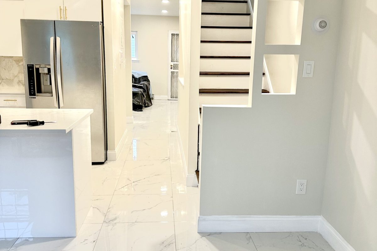 Full home renovation with new tile flooring, kitchen upgrade, and modern interior remodeling by DLS Construction LLC